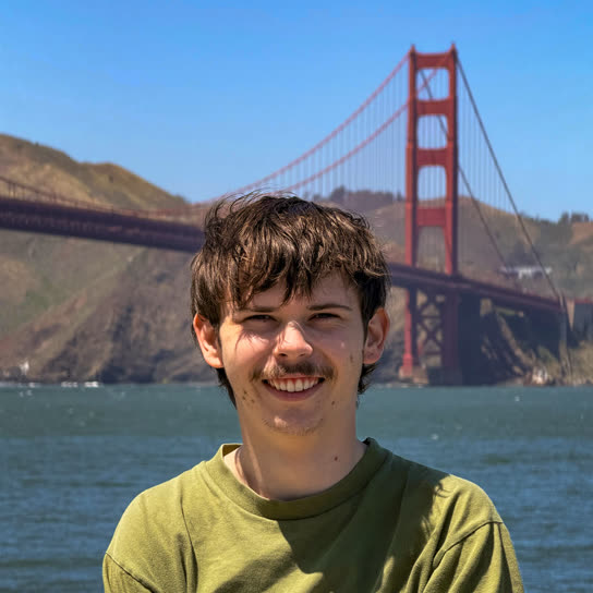 Archer Hume in front of the Golden Gate Bridge